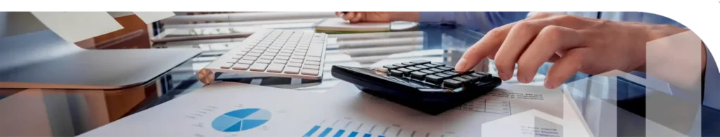 An image of a keyboard and a hand using a calculator