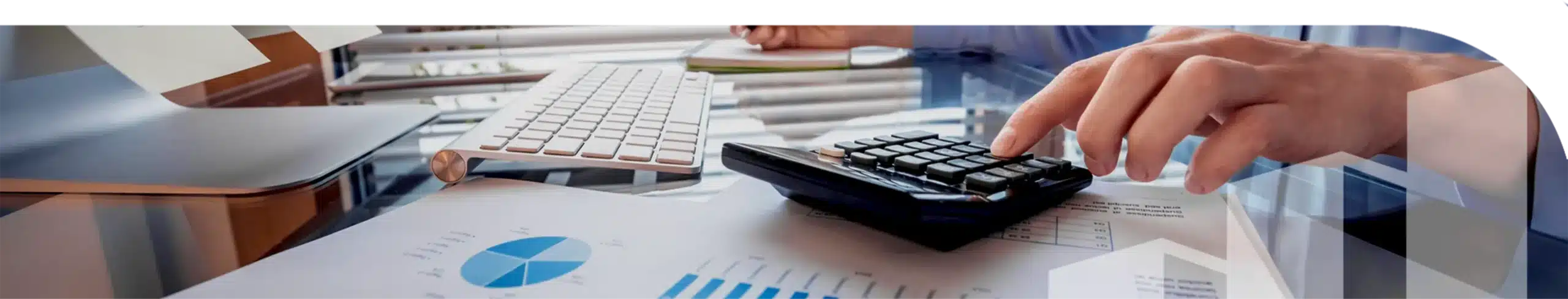An image of a keyboard and a hand using a calculator