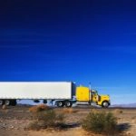 trucking rig against blue sky