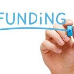 hand writing the word funding