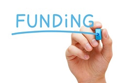 hand writing the word funding