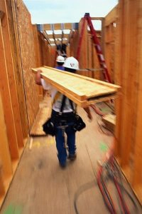 Construction Worker Carrying Board
