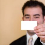 man holding business card