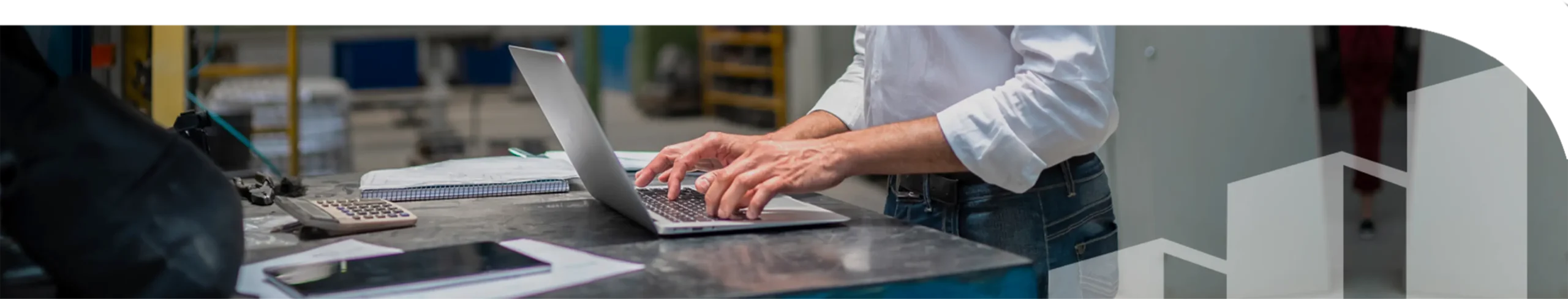 A man typing on a laptop